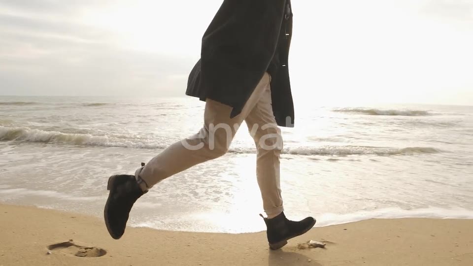 He runs into the sea, clothed, with joy