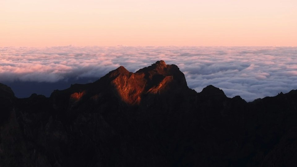 Dawn on the same mountains, empty and calm