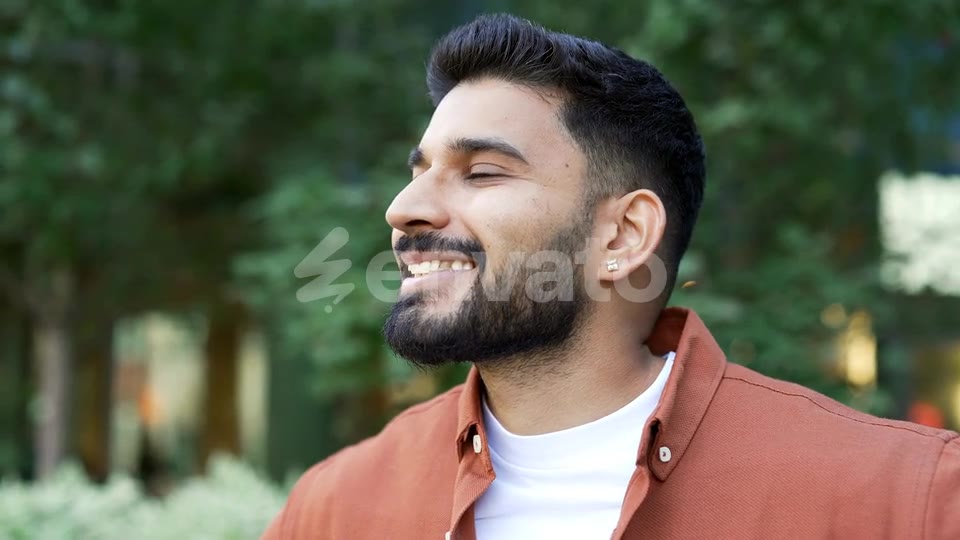 His eyes are closed. They open, he looks at the world and he smiles